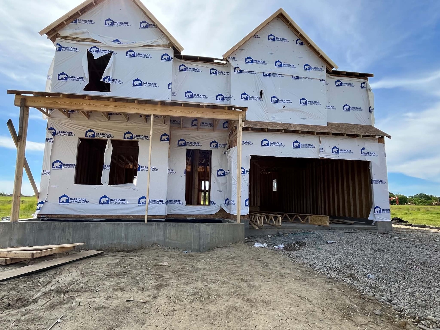 Two-story home framed and wrapped, under construction